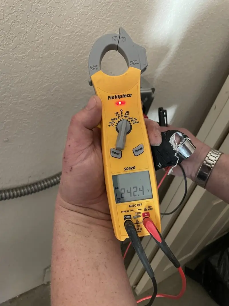Voltage testing with clamp meter during Whole House Surge Protector in Nederland